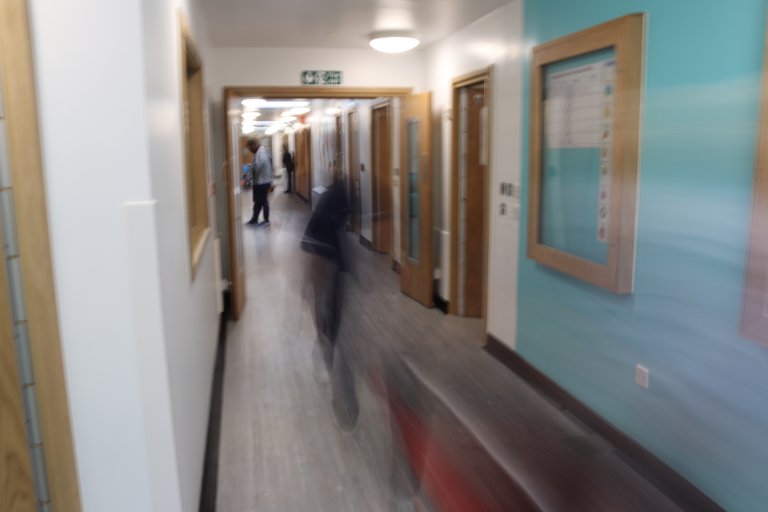 Blurry people in a corridor